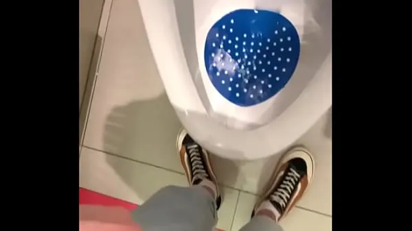 Fresh peeing in a urinal in a public toilet new Clips